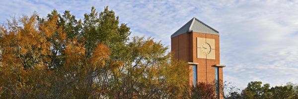 Fall foliage in front of the Halton Arena clock tower.